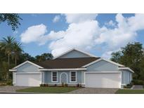 Two-car garage, light blue exterior, and a dark brown roof at 2051 Royal Tern Cir, Punta Gorda, FL 33983