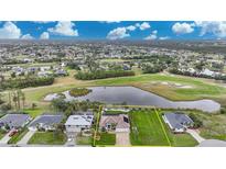 Aerial view of single-Gathering home with pool and large backyard, situated on a golf course at 31 Tee View Pl, Rotonda West, FL 33947