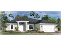 One-story home with a two-car garage and landscaped front yard at 8161 Dressel St, Port Charlotte, FL 33981