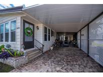 Florida mobile home with carport and landscaped yard at 368 Catamaran Ct, North Port, FL 34287