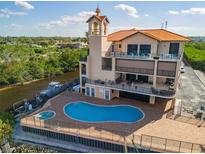 Luxury waterfront condo building with pool and boat slips at 900 E Marion Ave # 1403, Punta Gorda, FL 33950