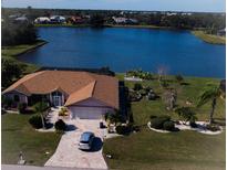 Single-story home with a large backyard, situated on a lakefront lot at 2259 Kenya Ln, Punta Gorda, FL 33983