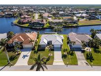 Aerial view showing the house's location in a waterfront community at 525 Madrid Blvd, Punta Gorda, FL 33950