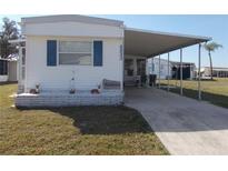 Charming single-story home featuring a covered parking area and well-maintained landscaping at 5233 Palena Blvd, North Port, FL 34287