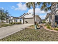 Charming home featuring well-kept landscaping, inviting curb appeal, and a two-car garage at 25120 E Lenox Cir, Punta Gorda, FL 33950