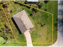 Aerial shot with property boundary lines, and spacious lawn at 616 Posadas Cir, Punta Gorda, FL 33983