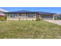 Charming single-story home with a well-manicured lawn and updated roofing at 430 Capri Isles Ct, Punta Gorda, FL 33950