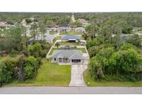 Beautiful single-story home with a well-maintained yard and screened pool, nestled in a serene, tree-lined neighborhood at 4571 La Rosa Ave, North Port, FL 34286