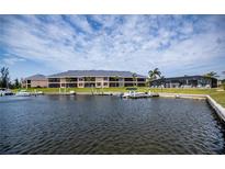Waterfront condominiums with docks and swimming pool offer a serene and luxurious living experience at 3256 White Ibis Ct # 13B, Punta Gorda, FL 33950