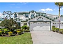 Charming two-story home featuring a well-maintained lawn and a spacious two-car garage at 726 Connemara Ct, Venice, FL 34292