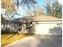 Charming single-story home with a two-car garage and well-maintained landscaping in a tranquil setting at 5098 Adina Cir, North Port, FL 34291