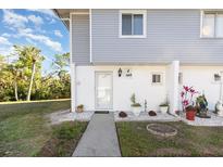 Charming condo with covered entry and well-maintained landscaping and front yard at 22375 Edgewater Dr # 149, Punta Gorda, FL 33980