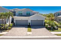 Beautiful two-story home with a two-car garage and a well-maintained brick driveway at 14640 Sycamore Ct # 2812, Punta Gorda, FL 33955