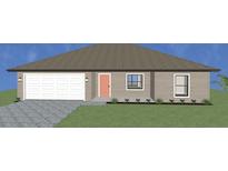 Charming one-story home with a two-car garage and a well-maintained front yard at 17331 Elmwood Ave, Port Charlotte, FL 33948