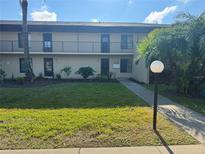 Inviting two-story condo with well-maintained lawn and landscaped garden at 4072 Oakview Dr # C5, Punta Gorda, FL 33980