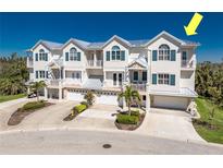 Beautiful multi-level townhouses with light exteriors, multiple balconies, and garages at 10300 Tarpon Landings Ter # 4, Placida, FL 33946
