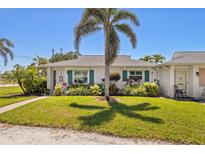 Charming single-story home with a well-manicured lawn and lush landscaping in a serene neighborhood at 196 The Corso # 196, Venice, FL 34285