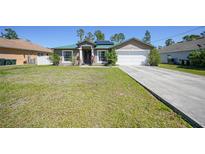 Charming single-story home featuring a well-maintained lawn, a two-car garage, and solar panels for energy efficiency at 1406 Woodcrest, North Port, FL 34286