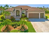 Charming single-story home with a well-manicured lawn and a two-car garage at 1341 Pine Siskin Dr, Punta Gorda, FL 33950