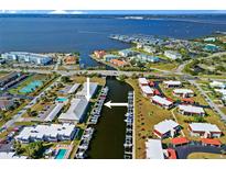 Stunning aerial view of waterfront community with boat docks and access to the Gulf of Mexico at 220 Coldeway Dr # 211, Punta Gorda, FL 33950