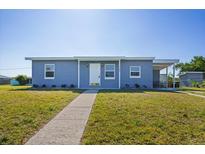 Charming single story home featuring a well maintained lawn and a clean, modern exterior at 3124 Crestwood Dr, Port Charlotte, FL 33952