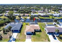 Waterfront property with a dock and canal access in a residential neighborhood, perfect for boating enthusiasts at 18462 Alphonse Cir, Port Charlotte, FL 33948