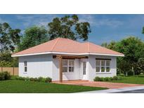 Cozy brick home with a charming pergola and a well-maintained lawn at 20208 Winkler Ave, Port Charlotte, FL 33954