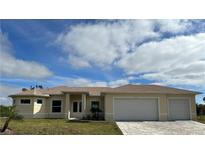 Inviting single-story home with a neutral-colored exterior, well-maintained lawn, and a convenient two-car garage at 8136 Sweden Blvd, Punta Gorda, FL 33982
