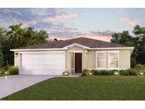 Charming single-story home featuring a two-car garage, well-manicured lawn, and neatly arranged shrubbery at 3899 Geary Ter, North Port, FL 34288