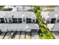 A beautiful aerial view of condos with lovely landscaping, private garages and close proximity to the water at 14281 Heritage Landing Blvd # 1418, Punta Gorda, FL 33955