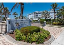 Community entrance featuring lush landscaping, elegant signage, and a secure gated entry at 2001 Bal Harbor Blvd # 2312, Punta Gorda, FL 33950