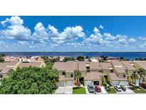 Waterfront townhomes boasting stunning water views, tropical landscaping, and convenient garage parking at 25188 Marion Ave # 1033, Punta Gorda, FL 33950