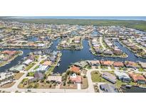 Stunning aerial view of waterfront homes with canals and boat docks in a desirable coastal community at 2621 Via Veneto Dr, Punta Gorda, FL 33950