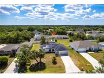 Spacious single-Gathering home with solar panels in a well-maintained neighborhood with mature trees at 1721 Nicollett Ave, North Port, FL 34286