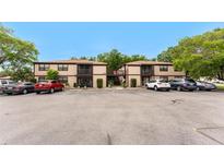 Exterior view of a well-maintained condo with a balcony and ample parking at 4022 Beaver Ln # 500C, Port Charlotte, FL 33952