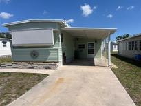 Charming single-story home with a covered carport and well-maintained lawn at 5025 Palena Blvd., North Port, FL 34287