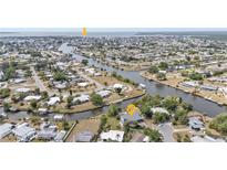 Waterfront property with canal access and serene neighborhood views perfect for boating enthusiasts at 103 Curtis Ne Ter, Port Charlotte, FL 33952