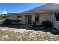 Charming single-story home featuring lush landscaping, a cozy entryway, and a well-maintained lawn at 25068 Harborview Rd # 3D, Punta Gorda, FL 33980