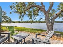 Inviting patio area with serene lake views, perfect for relaxation and enjoying the natural surroundings at 3106 Heron Shores Dr, Venice, FL 34293