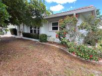 Well-maintained single-story home with tidy landscaping and curb appeal at 931 Juno Dr, Punta Gorda, FL 33950