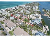Aerial view showcasing this coastal home's location, near the beach and harbor, surrounded by tropical landscaping at 2779 N Beach Rd # A, Englewood, FL 34223
