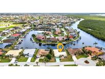 Stunning aerial view of waterfront homes with boat docks and access to a beautiful canal system at 3824 Aves Island Ct, Punta Gorda, FL 33950