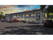 Condo building with ample parking spaces, exterior stairs and upper and lower units at 22375 Edgewater Dr # 255, Punta Gorda, FL 33980