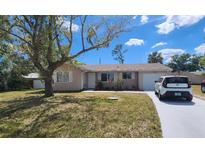 Charming single-story home with a well-maintained lawn and inviting curb appeal at 2306 Lee Ter, Port Charlotte, FL 33952