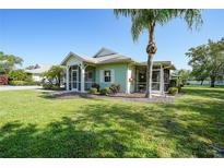 Charming single-story home featuring a screened-in porch and a well-maintained lawn at 2024 Royal Tern Cir, Punta Gorda, FL 33983