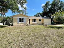 Charming single-story home with a well-maintained lawn and inviting curb appeal on a bright, sunny day at 2314 Lee Ter, Port Charlotte, FL 33952