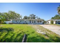 Charming single-story home featuring a well-maintained lawn, covered entry, and a classic architectural design at 31 Oberlin Rd, Venice, FL 34293
