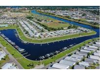 This aerial view depicts an active over-55 community with waterfront and recreational amenities at 805 S Green Cir, Venice, FL 34285