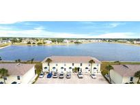 A charming multi-Gathering home with a beautiful lake view and ample parking spaces at 26290 Rampart Blvd # D, Punta Gorda, FL 33983