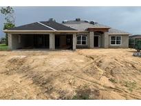 Under construction home featuring gray block construction and architectural details at 277 Long Meadow Ln, Rotonda West, FL 33947